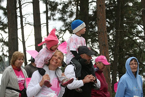&lt;p&gt;Rachel McDevitt of Coeur d'Alene looks up at her daughter Greta, 2, as they walk the dike road during the Race for the Cure.&lt;/p&gt;