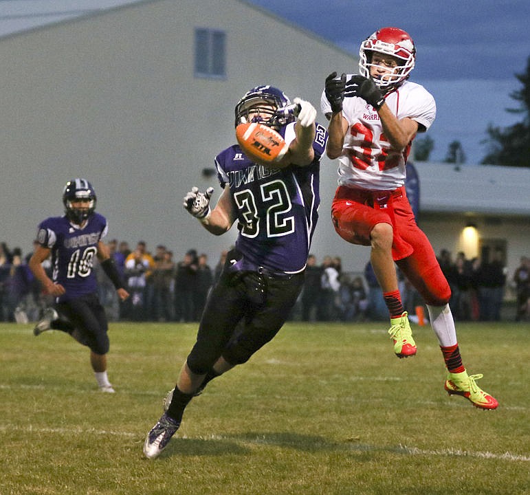 &lt;p&gt;Charlo's Jared Doty breaks up a pass intended for Harold Yocum on Friday night.&lt;/p&gt;