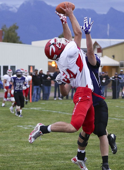 &lt;p&gt;Arlee's George Shick comes down with ball over a Charlo defender during their game on Friday night.&lt;/p&gt;