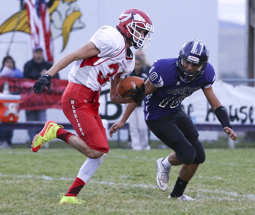 &lt;p&gt;Arlee's Harold Yocum tries to get by Charlo's Trent Dennison during their game on Friday night.&lt;/p&gt;