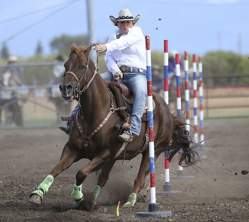 &lt;p&gt;Ronan's Hallie Sohr competes in pole bending at the high school rodeo in Polson on Saturday.&lt;/p&gt;