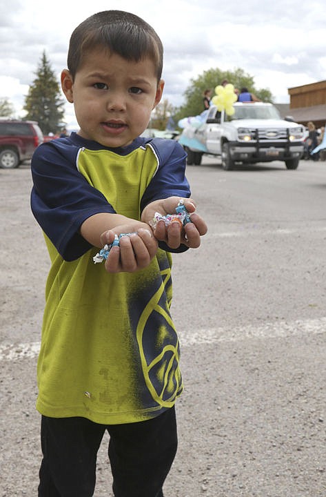 &lt;p&gt;Tommy Lozeau shows off his pile of candy during the parade in Charlo for their homecoming week.&lt;/p&gt;