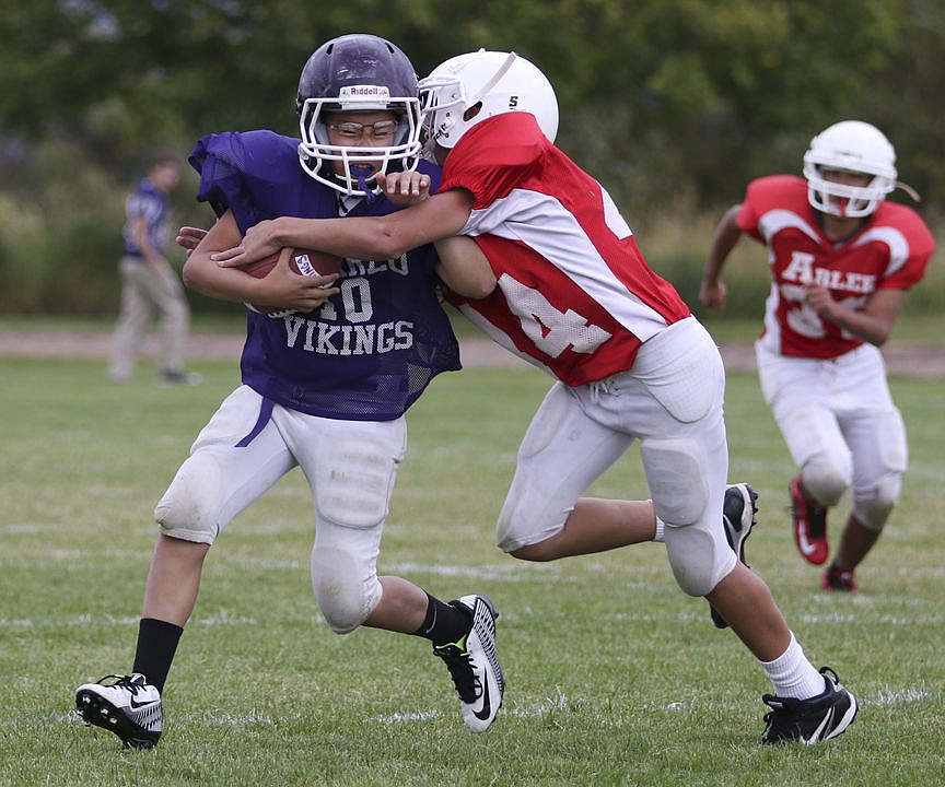 &lt;p&gt;Charlo's Dominic Marquez tries to get away from an Arlee defender Friday afternoon in the junior high game.&lt;/p&gt;