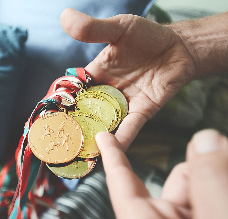 &lt;p&gt;Ryan Trout shows off his Special Olympics medals at the Lighthouse Christian Home on Monday afternoon, September 16, south of Kalispell. (Brenda Ahearn/Daily Inter Lake)&lt;/p&gt;