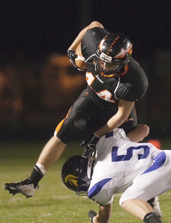 &lt;p&gt;Flathead running back Austin Root hurdles Missoula Sentinel&#146;s
Tanner Rheinschmidt (5) during a carry at Legends Stadium Friday
night.&lt;/p&gt;