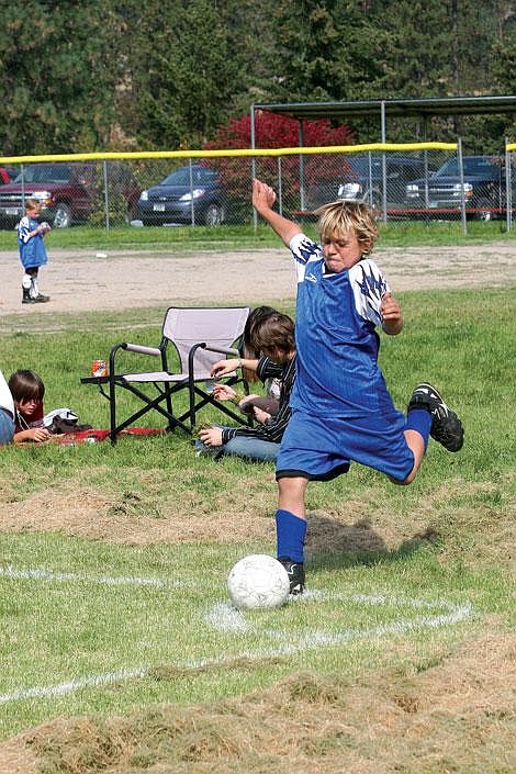 Nick Ianniello/Mineral Independent Superior Stomper Bridger LaPierre, 10, takes a corner kick during a game against a Frenchtown team Saturday morning.