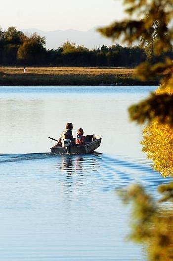 Two people in a motorboat head north Tuesday evening on the lower Flathead River. Boat use on the lower Flathead has more than quadrupled since 1992, according to a Montana Fish, Wildlife and Parks study. Nate Chute photos/Daily Inter Lake