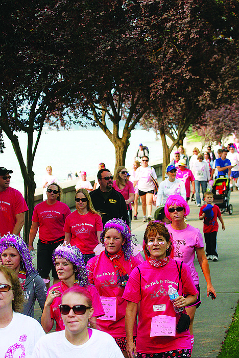 &lt;p&gt;Sea of pink by the lake: Participants dressed in pink walk across City Park during the race.&lt;/p&gt;