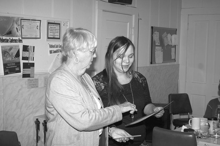 &lt;p&gt;Mary Lou Hermes provides Rachel Ibarra with a certificate of achievement for a poem Ibarra wrote.&lt;/p&gt;