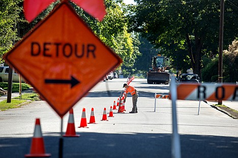 &lt;p&gt;GABE GREEN/Press A road worker sets out cones on Foster Avenue Tuesday morning. The right lane of the road is closed due to sidewalk repairs.&lt;/p&gt;