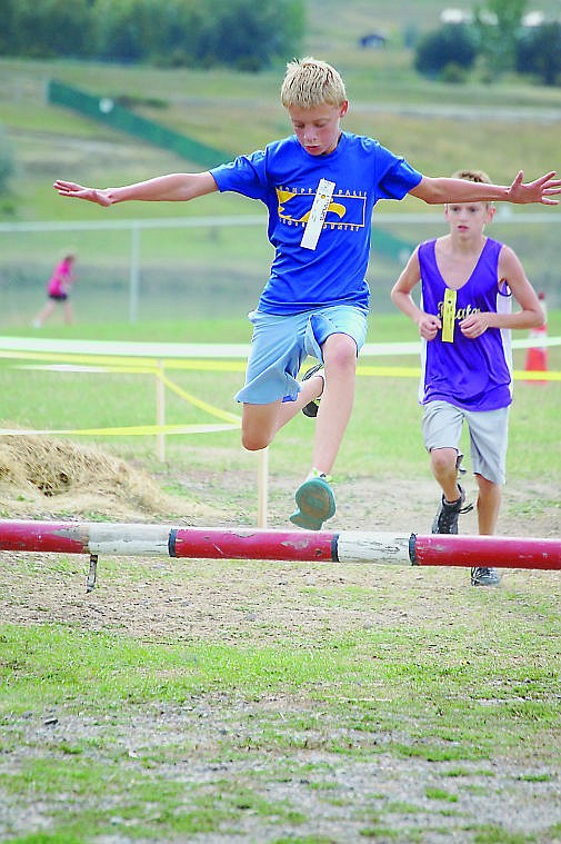 &lt;p&gt;Colby Lantz jumps over an obstacle at the Polson invitational last Saturday.&lt;/p&gt;