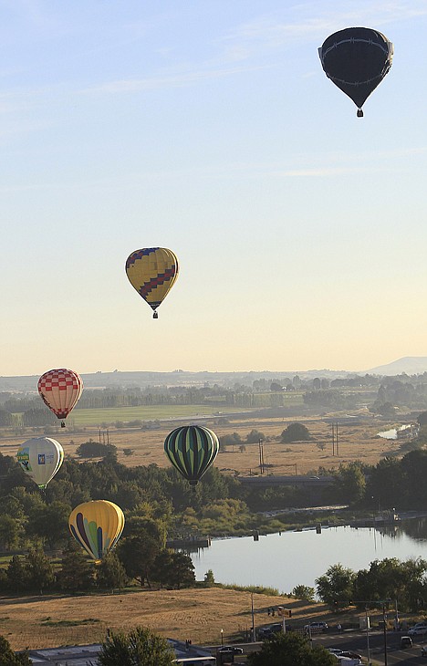 &lt;p&gt;Balloons float over Prosser, Friday. The early-morning balloon flight is part of the annual Prosser Balloon Rally.&lt;/p&gt;