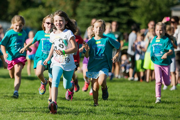 &lt;p&gt;SHAWN GUST/Press Rylan Sampson, a second grade student at Hayden Meadows Elementary, sports a toothy grin as she begins a one-mile cross country run Friday at the school's meet. About 130 students participated in the event.&lt;/p&gt;