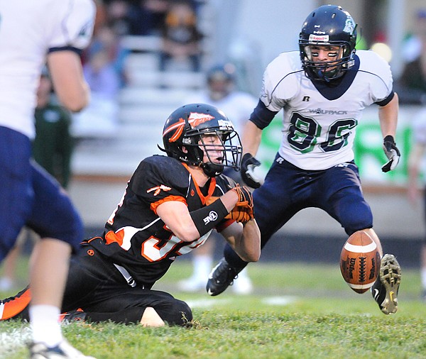 Flathead junior Al Olszewski drops a pass during the first half Friday night.