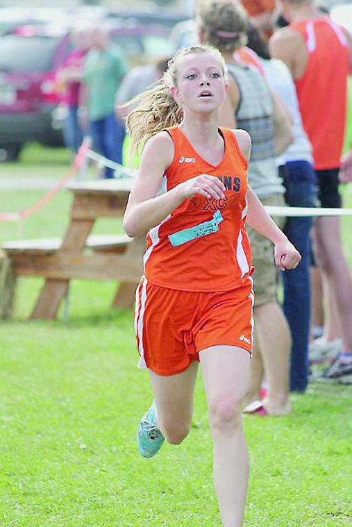 &lt;p&gt;Demi Horton competes for the Plains cross country team during the meet in Polson. Horton was the top finisher for the girls team.&lt;/p&gt;