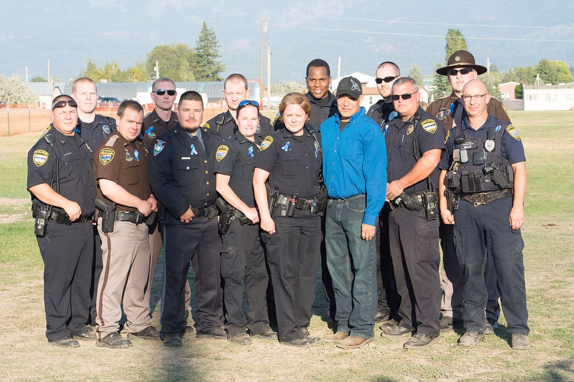 &lt;p&gt;Officer Cleveland poses with members of the law enforcement community.&lt;/p&gt;