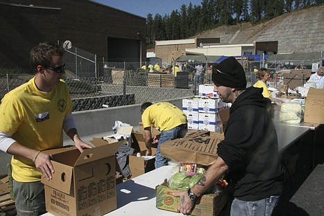 &lt;p&gt;Volunteer Chris Houghlum, left, passes out produce to Post Fals veteran Tim Chafin during the 2010 North Idaho Veterans Stand Down on Saturday at the Post Falls Armory.&lt;/p&gt;