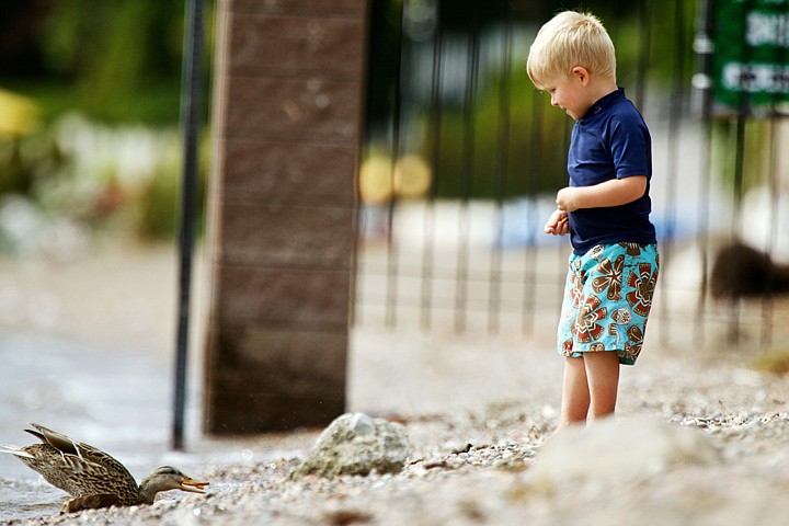 &lt;p&gt;JEROME A. POLLOS/Press Zion Warden, 3, feeds a duck some of his cracker snacks Tuesday while enjoying the sunshine with his mother at Sanders Beach in Coeur d'Alene.&lt;/p&gt;