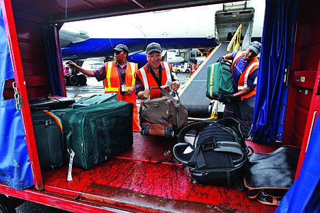 &lt;p&gt;In this Aug. 1 file photo, Delta Air Lines ramp agents unload bags from a flight arriving at JFK International airport in New York. U.S. airlines collected more than $1.7 billion in baggage fees during the first half of the year, the largest amount ever collected in that six-month period.&lt;/p&gt;