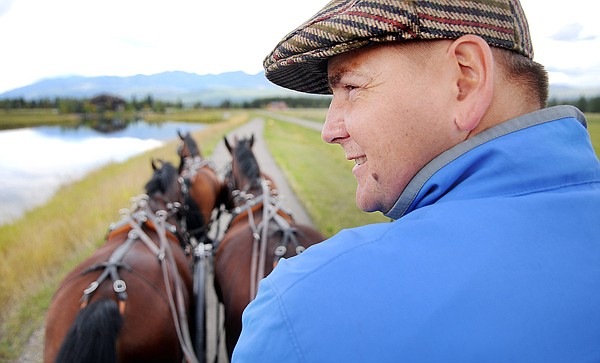 Piotr Mazurek leads the team of four warm bloods on a drive in Whitefish on Thursday.