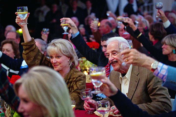 &lt;p&gt;Mustachioed association board member Harry A. Merlo, a former Marine and founding president of a lumber empire, joins the others in raising his glass while 4Troops sang a rousing rendition of the Kiss song, &quot;Raise Your Glasses.&quot;&lt;/p&gt;