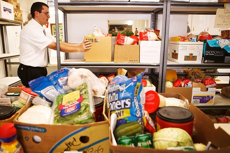 &lt;p&gt;Volunteer Elder Jairl organizes boxes of food Thursday afternoon at the North Valley Food Bank in Whitefish. Operations at the food bank have outgrown the current facility and plans are being made to build a new building.&lt;/p&gt;