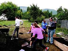 &lt;p&gt;The John Brown Elementary crew, with Jazmine Dove (foreground) leading the pack, work on Saturday on the school&Otilde;s Cougar Patch.&lt;/p&gt;