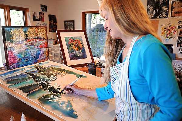 &lt;p&gt;Julie Wulf works on a silk painting of the view from her studio,
a piece she has titled &#147;Spring on Peaceful Bay,&#148; Thursday afternoon
in Lakeside. She is one of 17 local artists and artisans working in
diverse media &#151; from glass to leather to painting to pottery &#151;
taking part in the Hockaday Museum of Art&#146;s Local Color Studio
Tour. According to Brian Ekland, communications director, the goal
is to celebrate local artists and to get people out to see them so
people can experience live demonstrations of how the work is made,
ask about the artists&#146; inspirations and learn about the skills and
talent that go into the creation of these works of art. The tour
takes place from 10 a.m. to 5 p.m. today and Sunday throughout the
Flathead Valley. For artist information and a map, visit
www.hockadaymuseum.org.&lt;/p&gt;