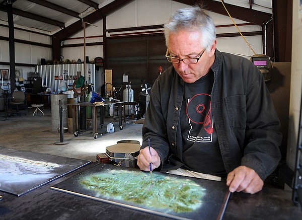 &lt;p&gt;Lee Proctor works on a crushed glass landscape on Tuesday
morning at his studio in Bigfork. His most recent series of
landscapes were done on site at the Teton Mountains in Wyoming.
Proctor will be demonstrating how he blows glass and then rolls
over these plates to create his lamps and vases.&lt;/p&gt;