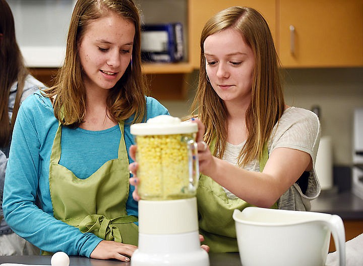 &lt;p&gt;Whitefish juniors Ashlyn Peacock and Madison Vick make Chipa Guazu a recipe shared by Emily Joy, a Peace Corps volunteer who has temporarily returned to Montana from her assignment in Paraguay. (Brenda Ahearn/Daily Inter Lake)&lt;/p&gt;