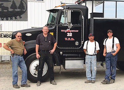 &lt;p&gt;Bill Branson, assistant chief at Hall Mountain, Chief Brad Lowther, North Idaho Ironworks owner Fred Nystrom, and Adam Michael, who did much of the work show off their completed wildland fire engine transformation Sept. 17.&lt;/p&gt;