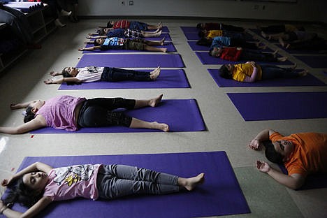 &lt;p&gt;Crockett Elementary students participate in a Yoga class as part of a new health and wellness effort coordinated by the national Sonima Foundation in Houston, Sept. 19.&lt;/p&gt;