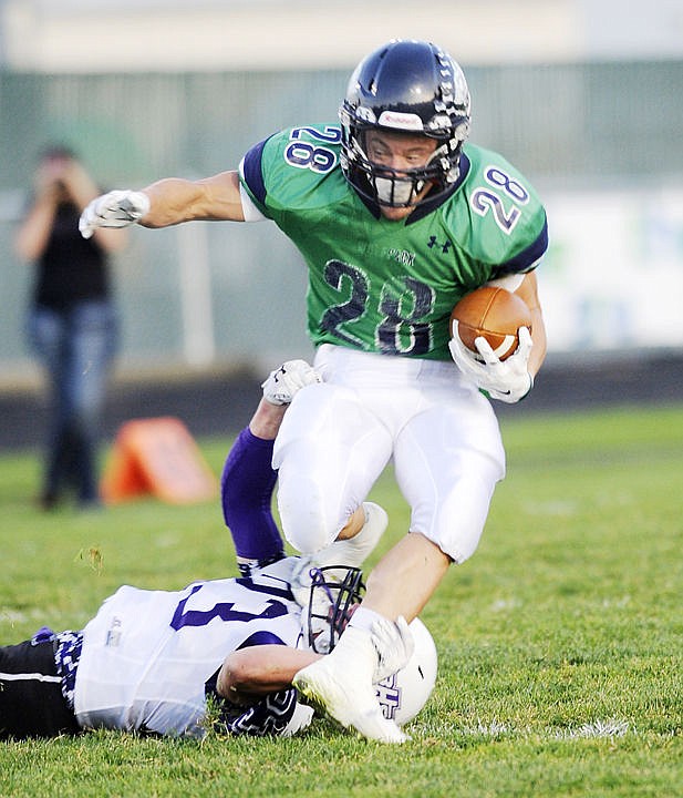 &lt;p&gt;Glacier running back Logan Jones breaks a tackle on a long catch in the first quarter against Butte on Friday. (Aaric Bryan/Daily Inter Lake)&lt;/p&gt;