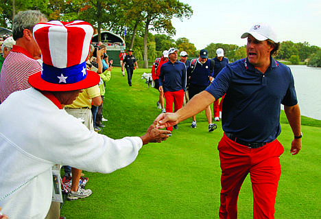 &lt;p&gt;USA's Phil Mickelson hands fan Richard Atkins a pin after teeing off on the second hole at the Ryder Cup PGA golf tournament Wednesday, Sept. 26, 2012, at the Medinah Country Club in Medinah, Ill. (AP Photo/Charles Rex Arbogast)&lt;/p&gt;