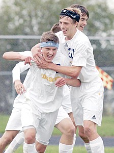 <p>Sophomore forward Johnny Davidson gets a celebratory hug from teammate Colin Maloney after scoring his second goal of the day vs. Bigfork Tuesday afternoon. (first half action) The Loggers went on to defeat the Vikings 2-0.</p>