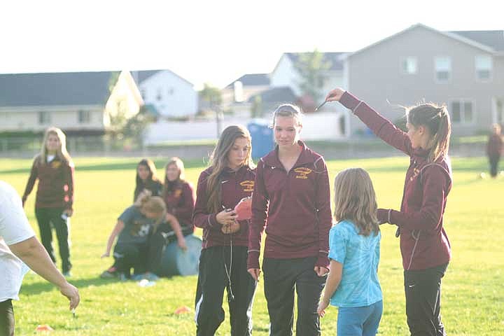 Alysha Overland (center) helps lead the Chiefs' youth soccer challenge Wednesday.