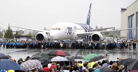 &lt;p&gt;Boeing Co. workers walk with an ANA Boeing 787 as it is brought forward during a delivery celebration, Monday, in Everett, Wash. Boeing Co. handed over the key for the first Boeing 787 to All Nippon Airways in a delivery ceremony Monday at Paine Field, near the factory where the wide-body jets are assembled.&lt;/p&gt;