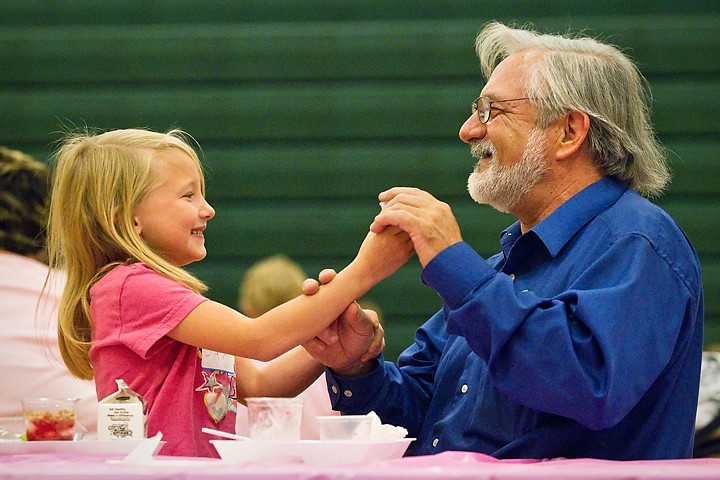 &lt;p&gt;SHAWN GUST/Press Daniel Mignault plays with his granddaughter Julia Mignault, 6, during a breakfast at Westridge Elementary School Wednesday celebrating Grandparent's Day. Nearly 300 students and grandparents attended the event at the Post Falls school.&lt;/p&gt;