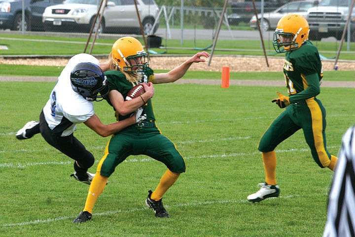 Tim Cranley II looks for relief from a North Star defender as teammate Shadrick Rich comes in to offer a hand.