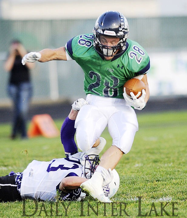 <p>Glacier running back Logan Jones breaks a tackle on a long catch in the first quarter against Butte on Friday. (Aaric Bryan/Daily Inter Lake)</p>