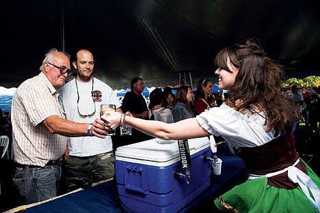 &lt;p&gt;Truman Dickeson, left, and his son Neil Dickeson try a sample beer from Meaghan Anderson&#160;during the Coeur d&#146;Alene Oktoberfest on Saturday evening.&#160;&lt;/p&gt;