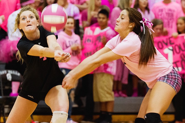 &lt;p&gt;SHAWN GUST/Press Coeur d'Alene High School's Kayla McGlathery hits the ball while Amy Norris provides back up in the second set Thursday during Volleyball for the Cure 2012 in Post Falls.&lt;/p&gt;