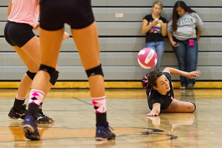 &lt;p&gt;SHAWN GUST/Press Brooke Litalien of Post Falls dives to the floor for the ball in the first set against Coeur d'Alene.&lt;/p&gt;