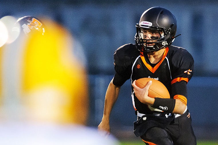 &lt;p&gt;FLATHEAD quarterback Easton Johnson runs during Flathead&#146;s Class AA homecoming football game with C.M. Russell at Legends Stadium Friday night.&lt;/p&gt;