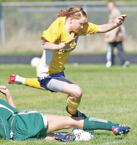 Myka Forster gets tangled up with Whitefish's Presley Pritchard in a battle for possession.