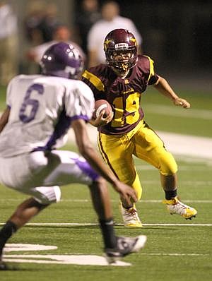 Jim McKiernan/Columbia Basin Herald<br> Moses Lake senior running back Jordan Estrellado (19) runs for a first down early in the Chiefs' 37-13 win over Pasco Friday night at Lions Field.