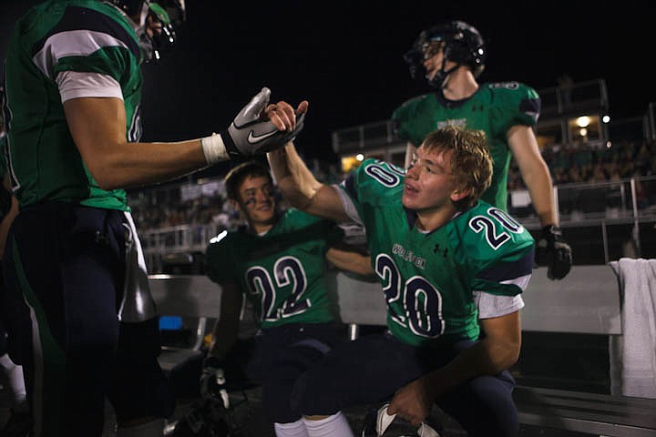 &lt;p&gt;Patrick Cote/Daily Inter Lake Teammates congratulate Glacier sophomore Evan Epperly (20) after he took an interception back for a touchdown Friday night during the sixth crosstown matchup at Legends Stadium. Friday, Sept. 28, 2012 in Kalispell, Montana.&lt;/p&gt;