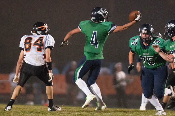 &lt;p&gt;Patrick Cote/Daily Inter Lake Glacier junior running back Noah James (4) stretches to catch a ball Friday night during the sixth crosstown matchup at Legends Stadium. Friday, Sept. 28, 2012 in Kalispell, Montana.&lt;/p&gt;