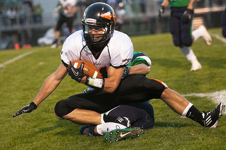 &lt;p&gt;Patrick Cote/Daily Inter Lake Flathead senior Austin Root (44) is tackled Friday night during the sixth crosstown matchup at Legends Stadium. Friday, Sept. 28, 2012 in Kalispell, Montana.&lt;/p&gt;