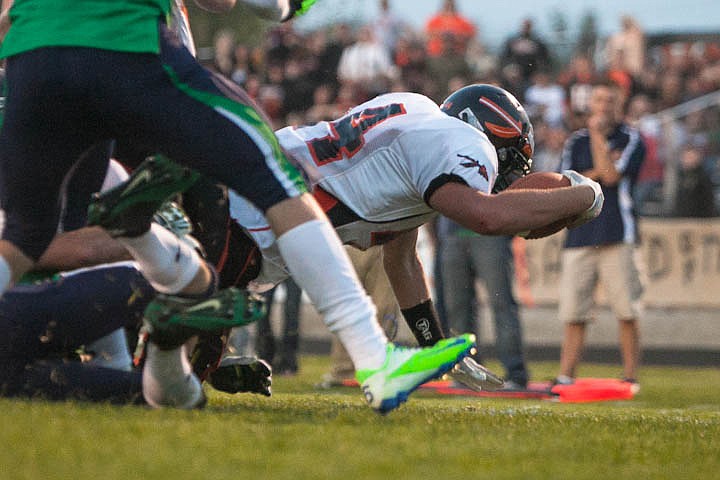 &lt;p&gt;Patrick Cote/Daily Inter Lake Austin Root (44) scores a diving touchdown Friday night during the sixth crosstown matchup at Legends Stadium. Friday, Sept. 28, 2012 in Kalispell, Montana.&lt;/p&gt;